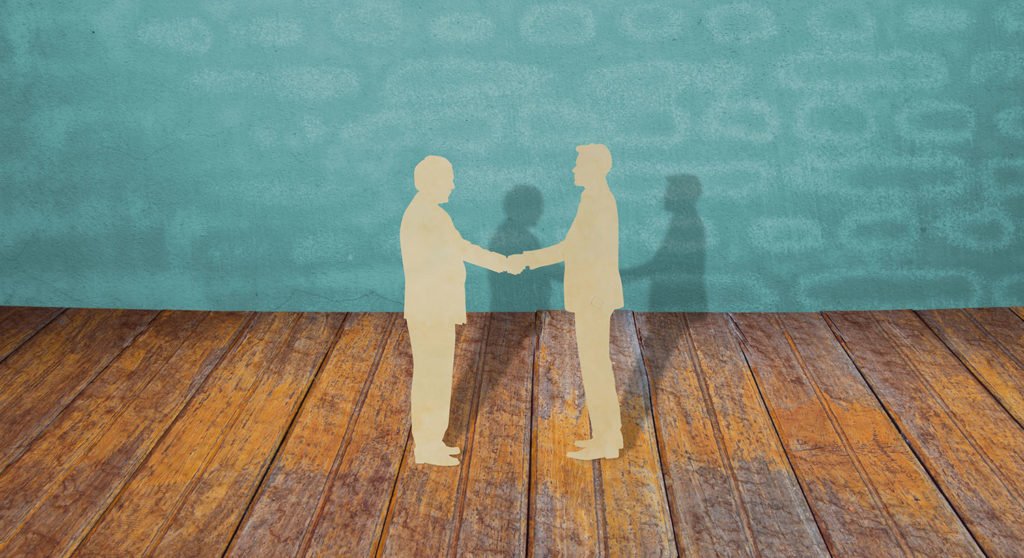 Paper cut of two business man shake hand